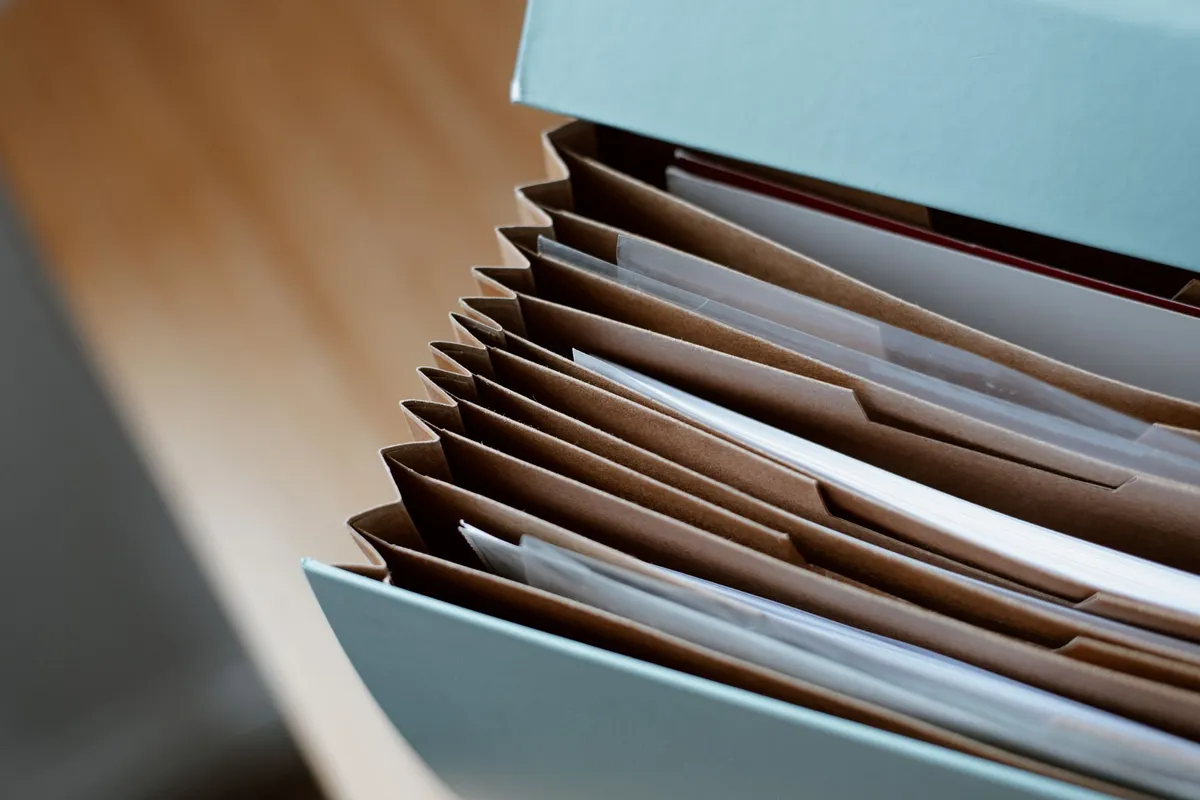A collection of case files stacked on a desk, representing the complexities of personal injury law.